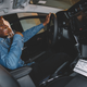 A guest at a Toyota-sponsored event for The Glow Up and Very Smart Brothas enjoys the RAV4.